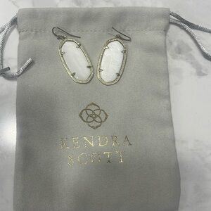 Kendra Scott white earrings.